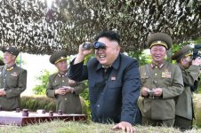 kim-jong-un-looking-through-a-pair-of-binoculars-during-inspection-of-hwa-islet-defence-detachme.jpg