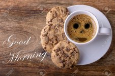 46781431-tasse-kaffee-mit-schokolade-cookies-auf-holz-und-guten-morgen-geschrieben.jpg